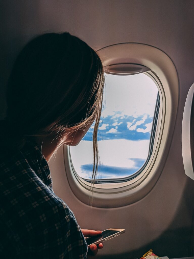 woman sitting on plane
