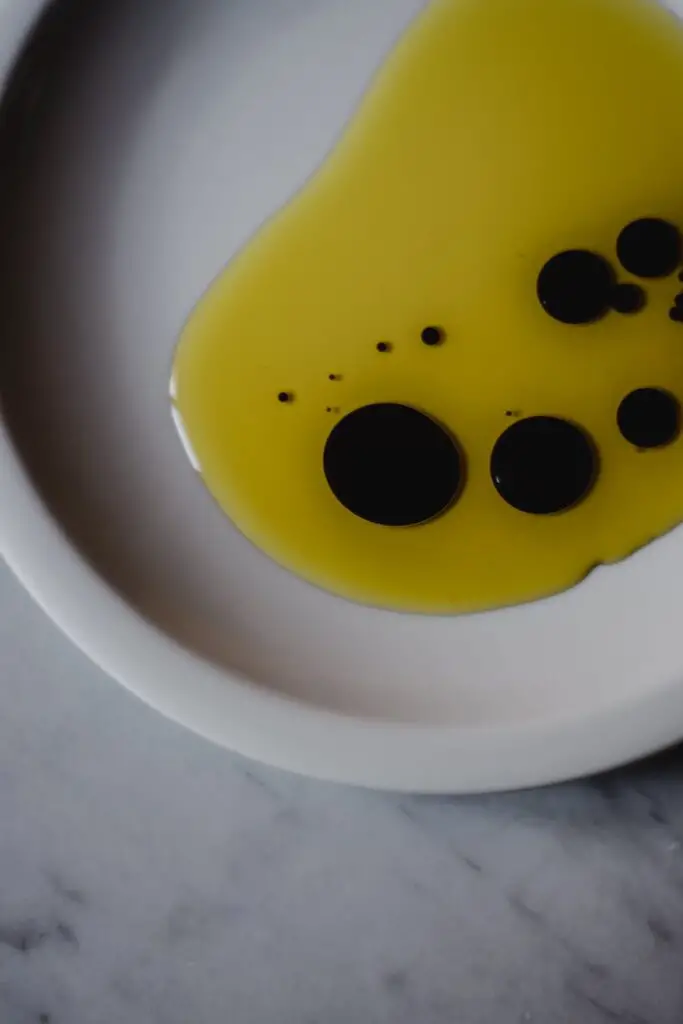 yellow and black smiley face on white ceramic bowl